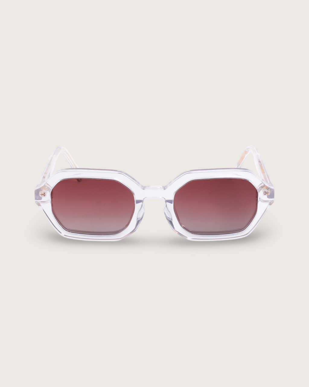 FERRO Crystal Ember sunglasses with clear acetate frame and brown gradient lenses for a modern style.