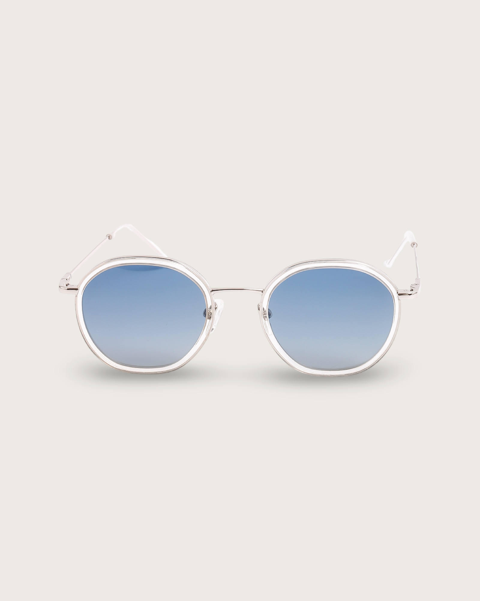 Dune Silver sunglasses with lightweight silver frames and polarised blue gradient lenses, showcasing a modern design.